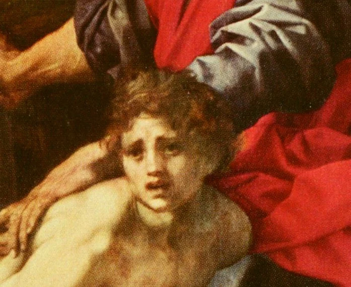 Isaac looks out of the picture, frightened. Abraham holds him by the arm.