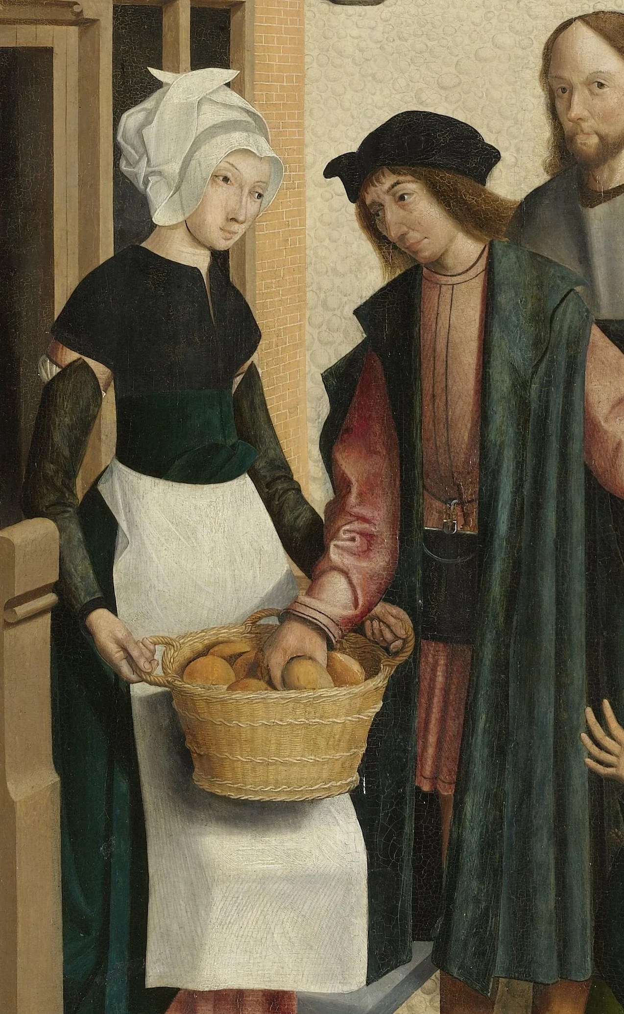 The woman takes the loaves from the basket one by one; hands reach towards her.