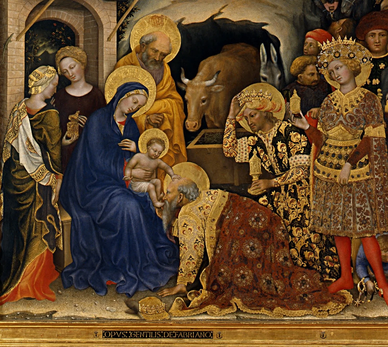 The child lays a hand on the old king's bald head.
