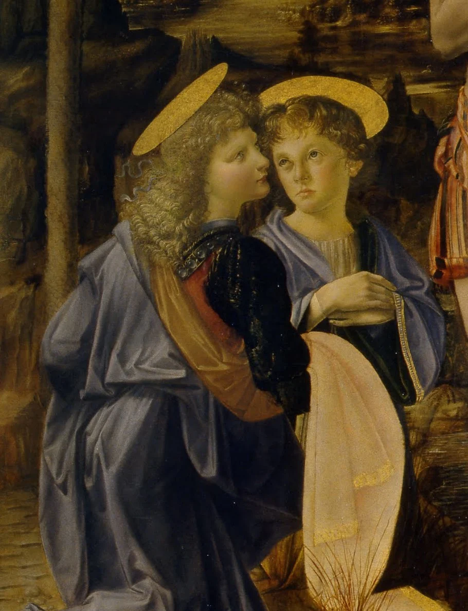The left angel, turned away and looking back over his shoulder, is attributed to Leonardo.