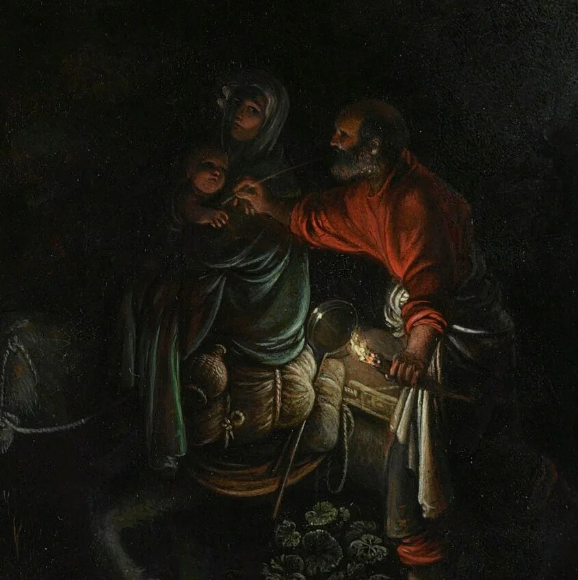 Joseph's torch lights only the three of them and the donkey.