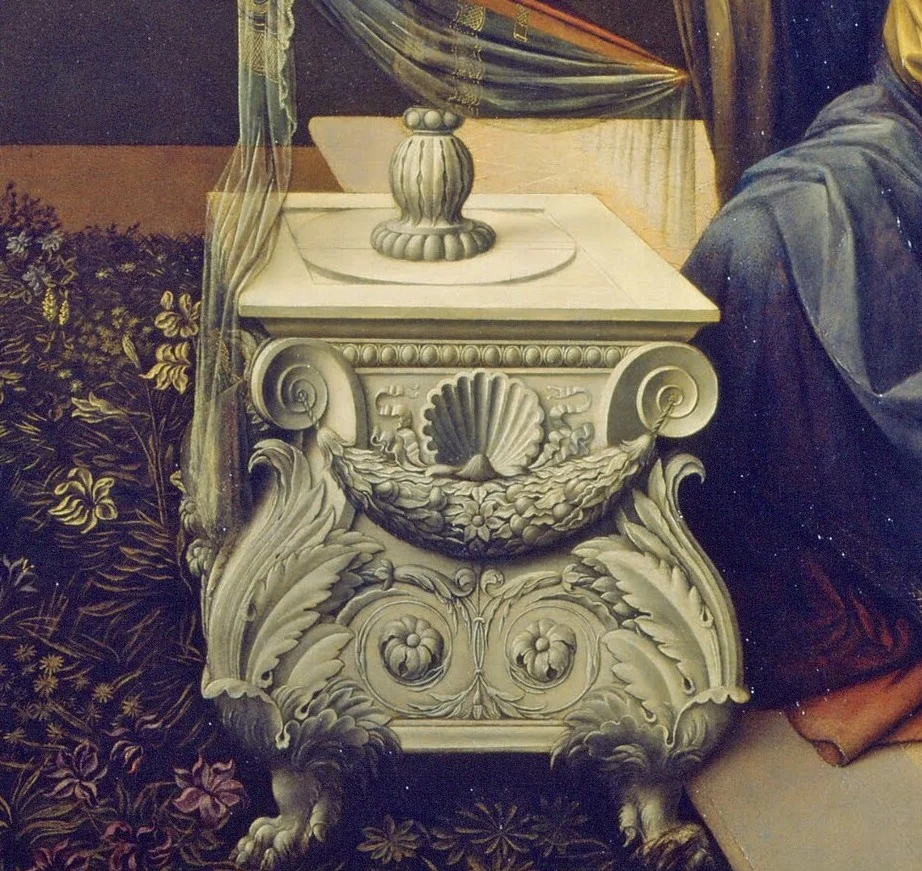 The marble desk is modelled on a tomb that Verrocchio made for the Medici in San Lorenzo.