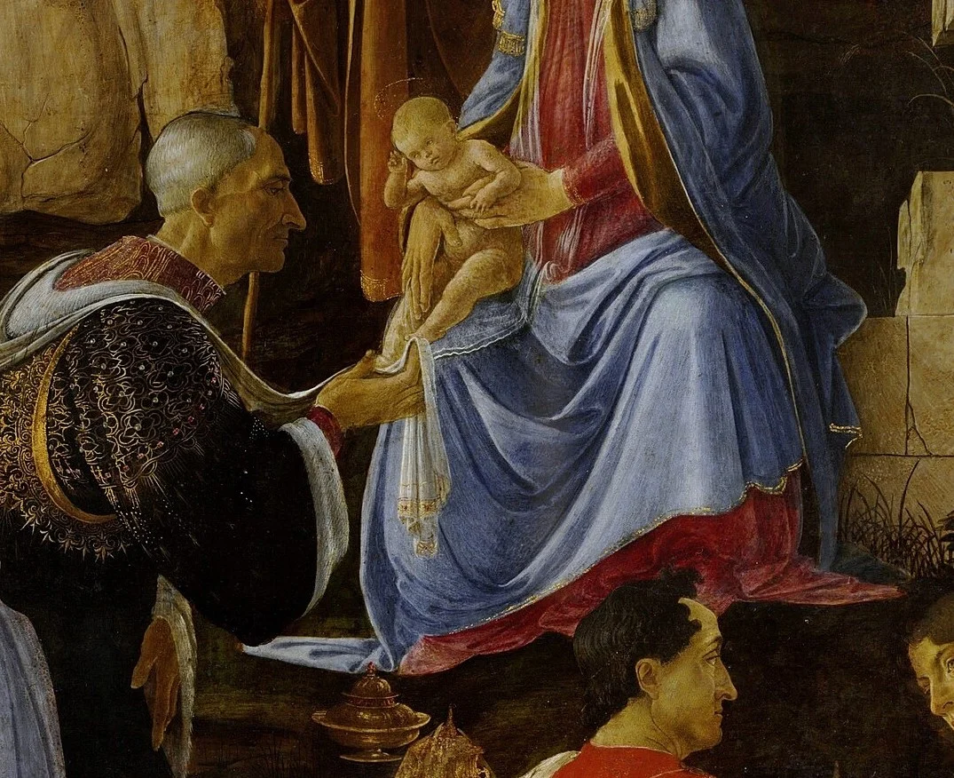 Der alte König fasst den Fuß des Kindes durch ein Tuch an.