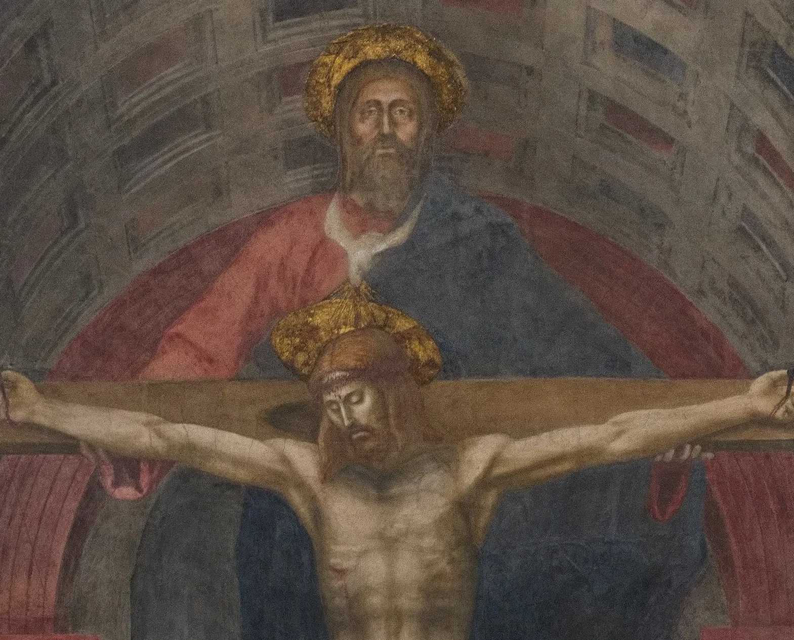 The Father stands behind the cross and holds its beam with both hands. Between his beard and the head of the Son hovers the dove of the Spirit, easy to mistake for a white collar.