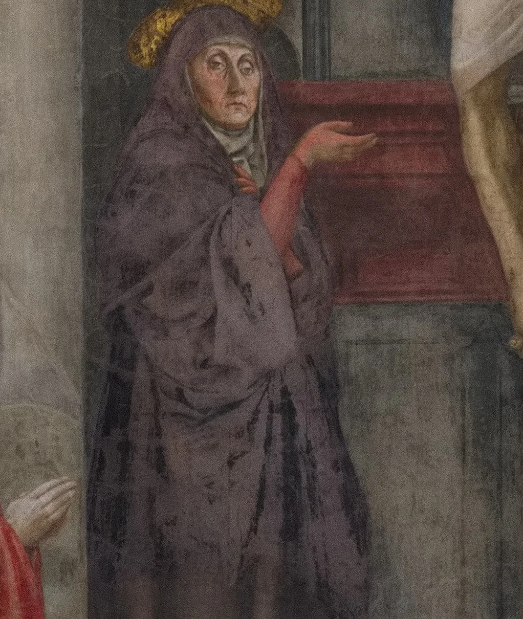 Mary does not look at her son. She looks at us and points to him with her hand.