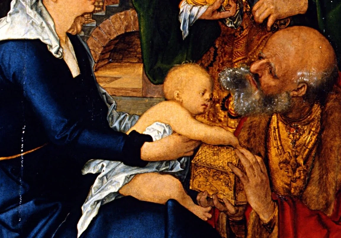 The child has both hands in the casket of gold.