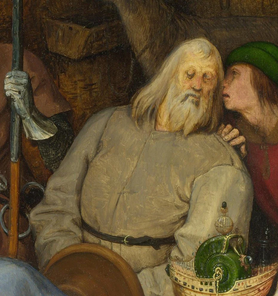 A man whispers into Joseph's ear, and Joseph listens.