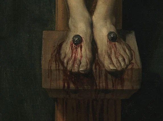 Each foot is nailed separately to a small wooden support.