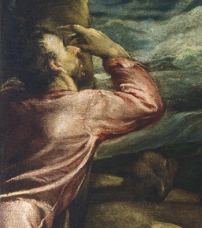 He is the first to notice: one arm raised against the brightness.