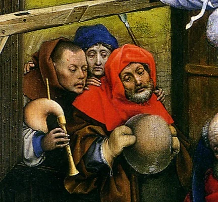 The shepherds have come up quietly. One of them carries a bagpipe.